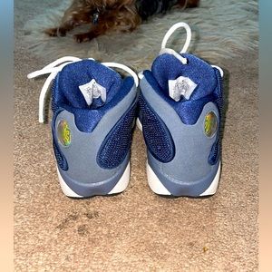 Air Jordan 13 Retro ‘Flint” still looks new,slightly worn.